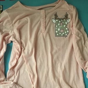 blush pink pajama top with the letter “B”